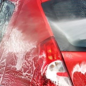 Pressure Washing a Car at Home in the Driveway