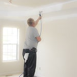 Homeowner Using a HVLP Sprayer to Paint Ceiling