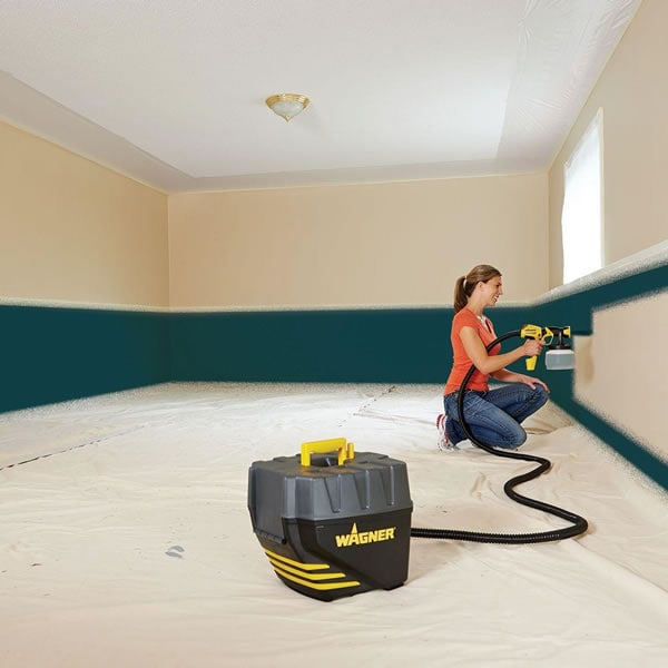 Woman Uses HVLP Paint Sprayer to Paint Wall Trim